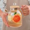 Teapot consists of a beautiful crystal clear teapot made from borosilicate glass and a bamboo lid. Heat resistant, can directly warm water on stove or induction stove.